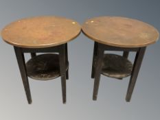 A pair of copper topped circular tables, height 63 cm.