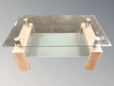 A modern glass topped coffee table,