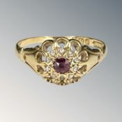 An antique 18ct gold ruby and diamond cluster ring, size R CONDITION REPORT: 2.