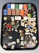 A group of miniature books, matchboxes, brass, trinkets, seashells, etc.