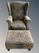 A wingback armchair and matching footstool.