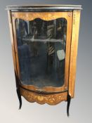 A French kingwood veneered bow-front corner display cabinet,
