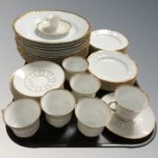 Thirty five pieces of Bing & Grondahl white and gilt tea and dinner porcelain.