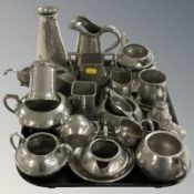 A collection of hammered pewter wares.