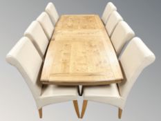 A good quality solid oak extending dining room table,