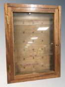 A teak key cabinet, with key, 61 cm x 45 cm.