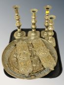 Two pairs of Victorian brass candlesticks, a group of chargers and a further pair of door plates.