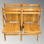 A set of four folding chairs.