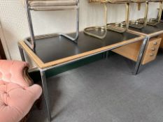 A Scandinavian metal framed oak writing desk with ebonised panel top,