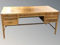 A 20th century Danish walnut seven drawer writing desk,