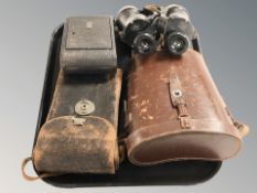 A pair of Ross of London 10x50 binoculars in leather case and a Kodak camera in case.