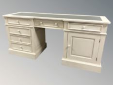 A painted dressing table with leather-inset panel,