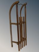 A vintage teak sledge