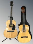 A Harmony acoustic guitar and a Hohner Concerta guitar, with one soft carry bag and a guitar stand.