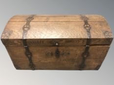 A 19th century oak and iron bound domed topped chest,
