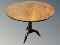 A 19th century oak tripod occasional table, height 70 cm.