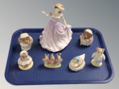 A Royal Doulton figure 'Beth' HN4156, together with six Royal Albert Beatrix Potter figurines.