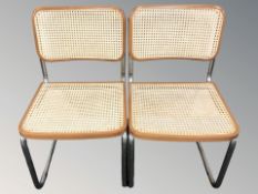 A pair of chrome cantilever chairs.