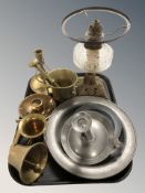 A brass and glass oil lamp, brass pestle and mortar, pewter ejector candlestick, dishes, etc.