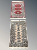 Two Lahore Bokhara rugs, Pakistan, each approximately 110 cm x 64 cm.