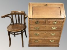 A 20th century oak bureau, 71 cm x 41 cm x 98 cm, together with a bentwood chair.