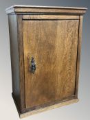 A 19th century oak single door wall cabinet,