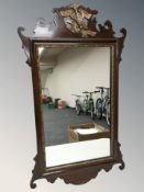 A chippendale style mahogany mirror, 70 cm x 39 cm.
