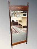 An inlaid mahogany bevelled mirror, 46 cm x 111 cm.
