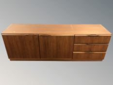 A 20th century teak low sideboard, 180 cm x 48 cm x 60 cm.