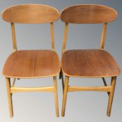 A pair of Danish laminated teak dining chairs