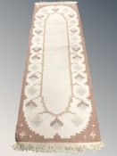 An eastern kilim runner, 250 cm x 82 cm.