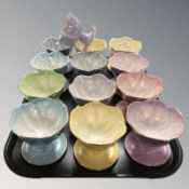 Thirteen Maling lustre grapefruit dishes in various colours.