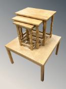 A Danish blonde oak coffee table, width 76 cm, and similar nest of three tables.