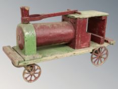 A hand made wooden model of a steam locomotive, length 92 cm.