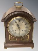 A mahogany and brass bracket clock with battery movement, height 32 cm.