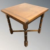 A 20th century oak pullout extending dining table, unextended 75 cm x 75 cm x 75 cm.