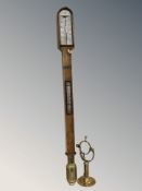 A walnut mercury barometer by Whyte of Glasgow, with brass stabilising wall bracket, length 94 cm.