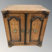 A Victorian oak smoker's cabinet, width 30 cm.