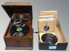 A mahogany HMV tabletop gramophone and a box of vinyl 78s.