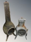 Two cast iron garden chimineas,