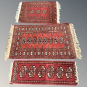 Three Afghan Turkoman rugs, largest 116 cm x 62 cm.