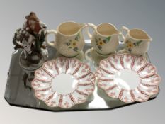 An Art Deco frameless mirror, a pair of Coalport porcelain plates,