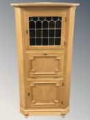A Danish blond oak and leaded glass corner cabinet,