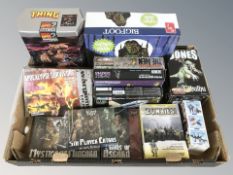 A group of tabletop gaming miniatures, some in retail cellophane,