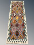 A Chobi Kilim runner, 194 cm x 65 cm.