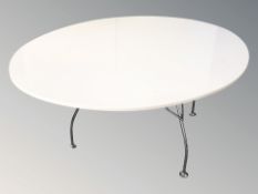 A Scandinavian chrome and moulded plastic oval dining table,