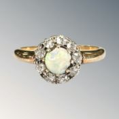 An 18ct gold opal and diamond cluster ring, size M CONDITION REPORT: 2.