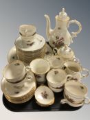 Thirty nine pieces of KPM floral decorated tea and dinner porcelain.