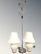 A chrome standard lamp and a pair of table lamps.