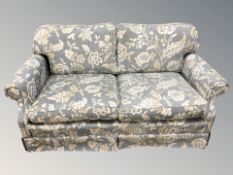 A floral upholstered two seater settee,